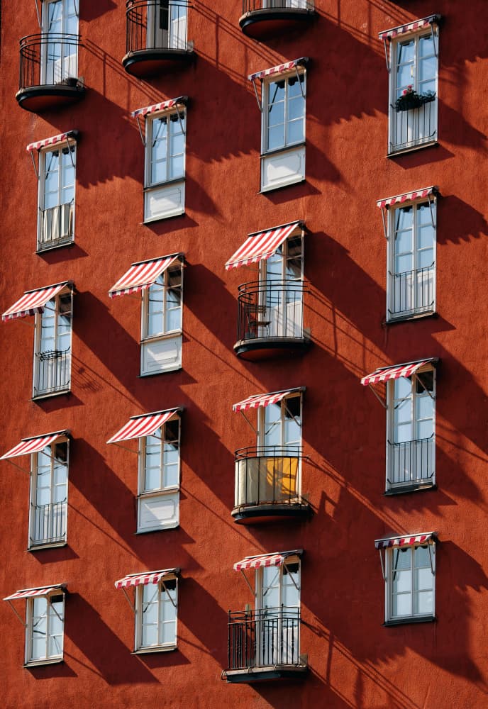Striped Awnings Facade by Karim Al Thahaby — canvas wall art