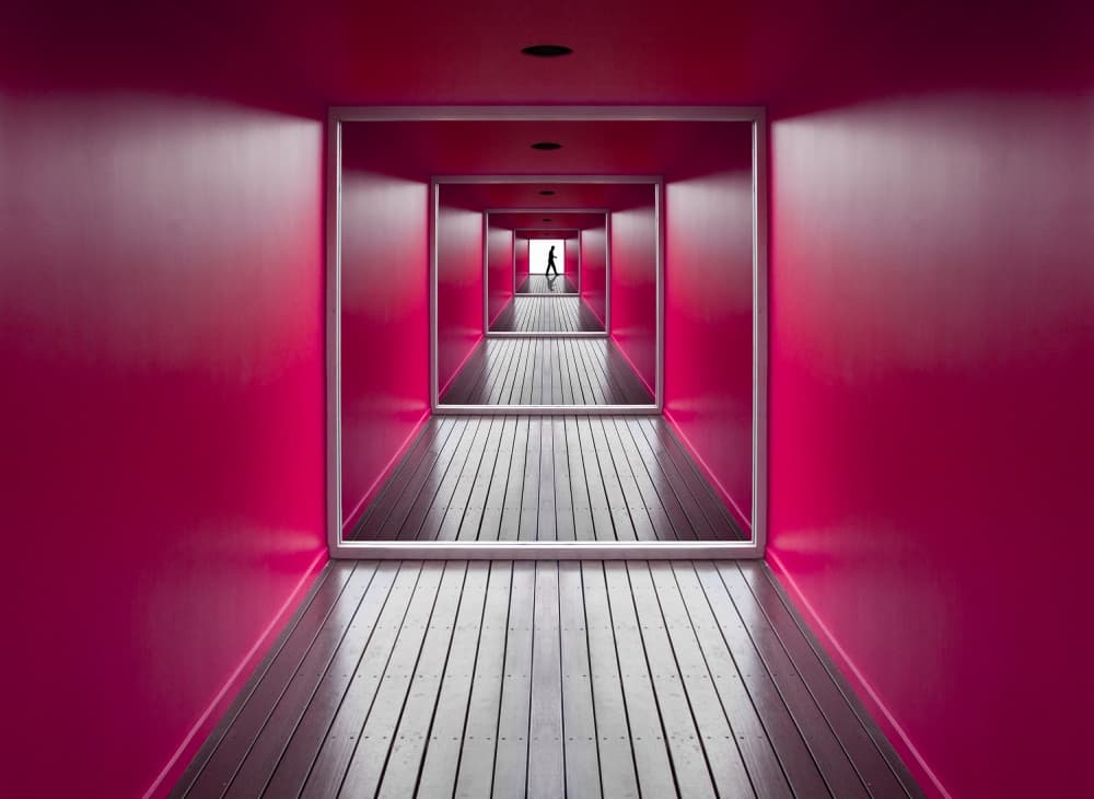 Lone Figure Pink Hallway by Jacqueline Hammer — canvas wall art