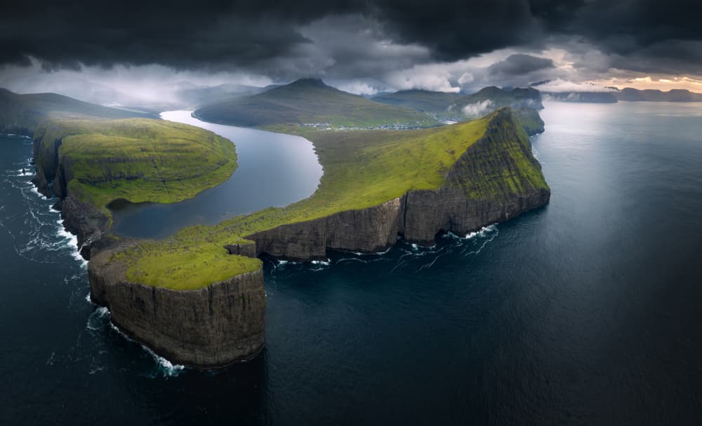 Dramatic Island Lake Cliffs by Karol Nienartowicz — canvas wall art