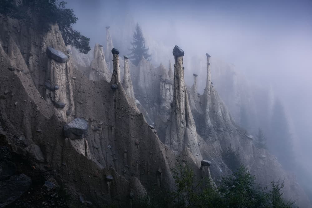 Misty Earth Pillars by Karol Nienartowicz — canvas wall art