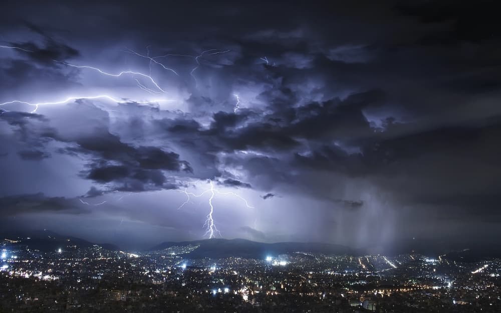 Lightning Over City Lights by Chris Kaddas — canvas wall art