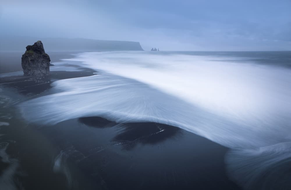 Misty Black Sand Beach by Nicolas Schumacher — canvas wall art
