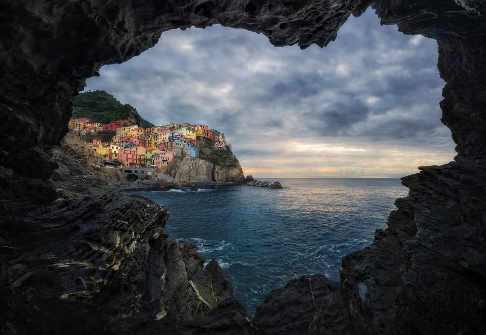 Vibrant Coastal Village by Ales Komovec — canvas wall art