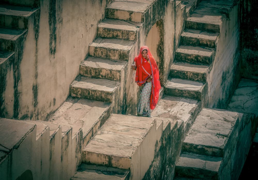 Red Woman in Stepwell by Frank Ma — canvas wall art
