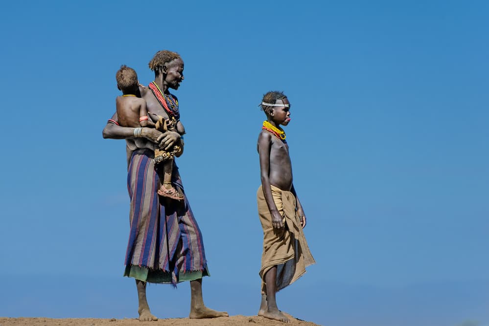 African Tribal Family Portrait by Piet Flour — canvas wall art
