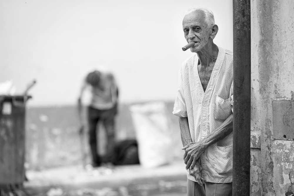 Old Man Smoking Cigar by Dan Mirica — canvas wall art