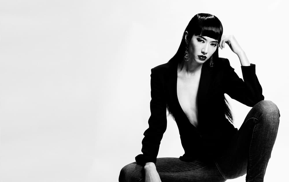 Confident Woman in Blazer by Keiichi Ishikawa — canvas wall art