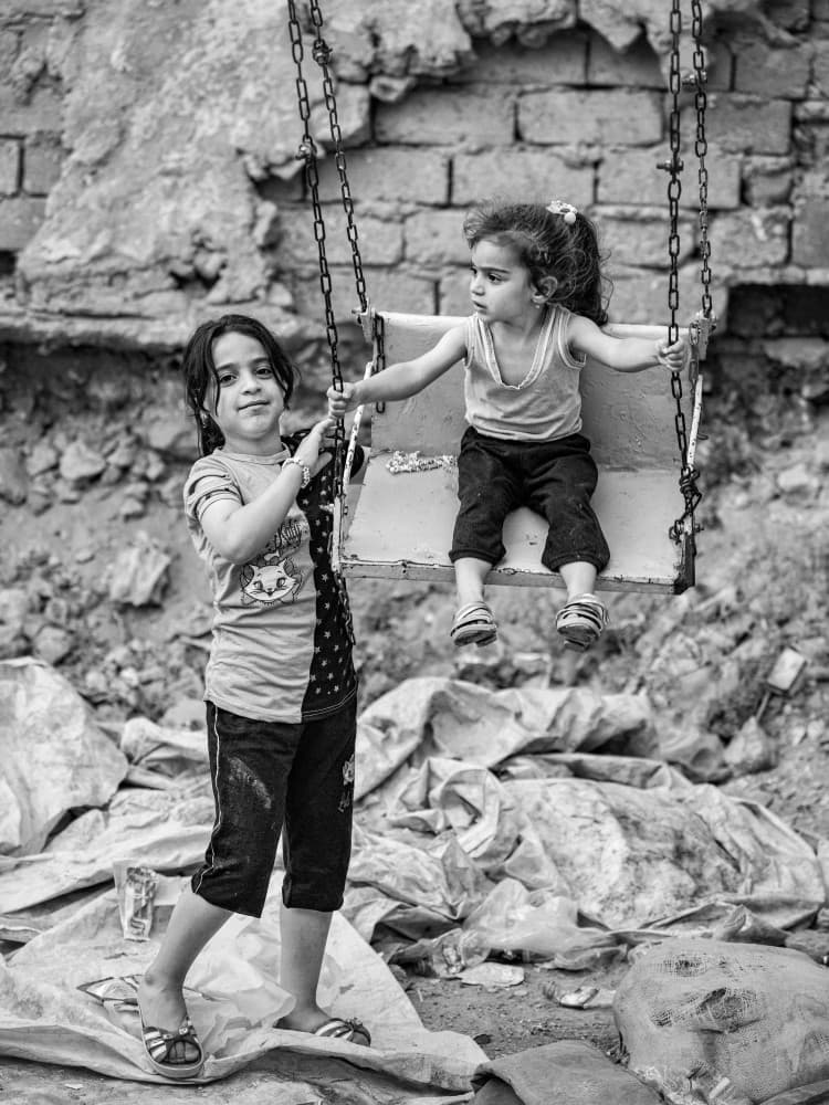 Girls On A Swing by Bashar Alsofey — canvas wall art