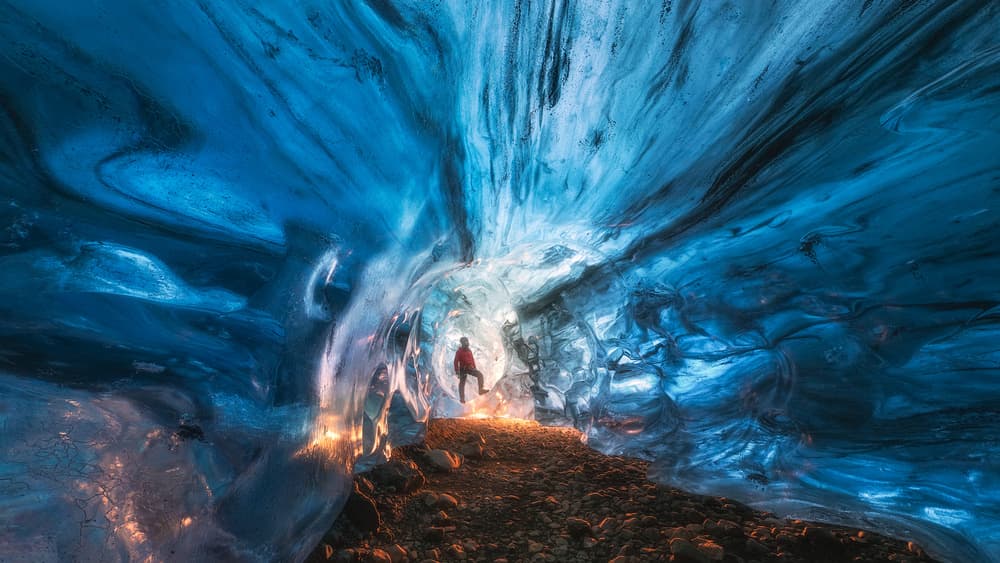 Blue Ice Cave Explorer by Tomasz Rojek — canvas wall art