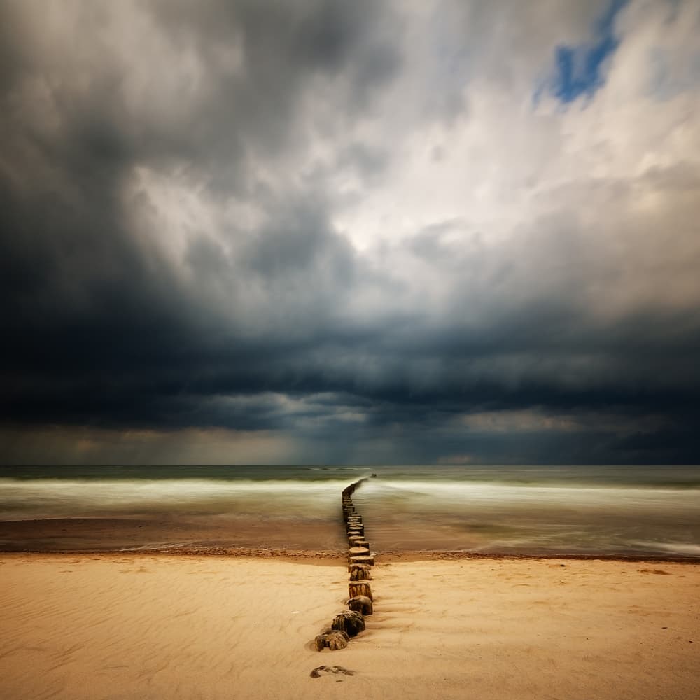 Dramatic Beach Groyne by Piotr Krol (Bax) — canvas wall art