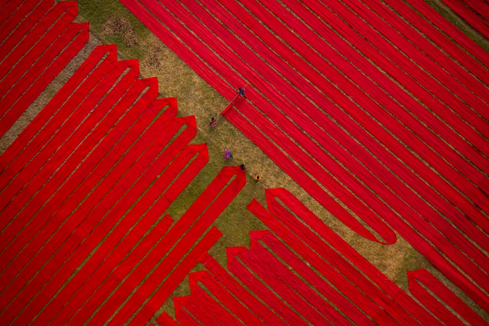 Vibrant Red Fabric Fields by Azim Khan Ronnie — canvas wall art