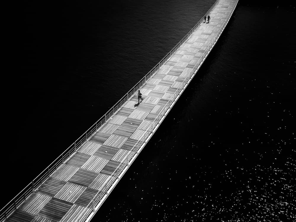 Monochrome Bridge Walk by Christophe Staelens — canvas wall art