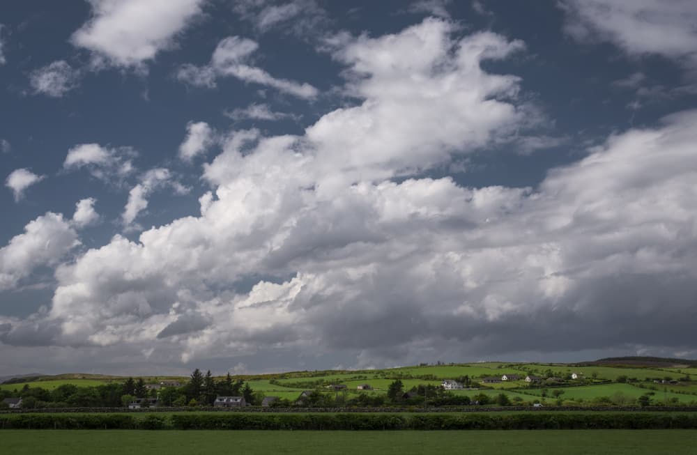 Rolling Hills Cloudy Sky by Lynann Colligan — canvas wall art