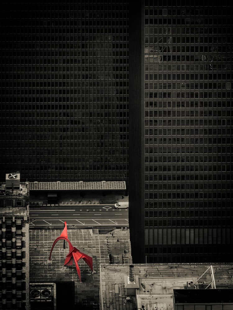 Red Sculpture Cityscape by Christopher Budny — canvas wall art