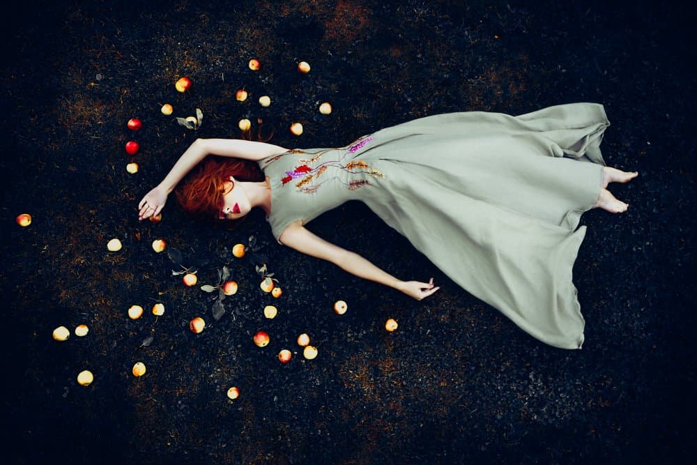Woman Among Fallen Apples by Ruslan Bolgov — canvas wall art