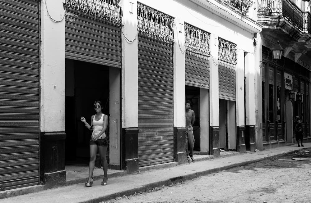 Woman in Havana Doorway by Andrei Nicolas - The Traveler — canvas wall art