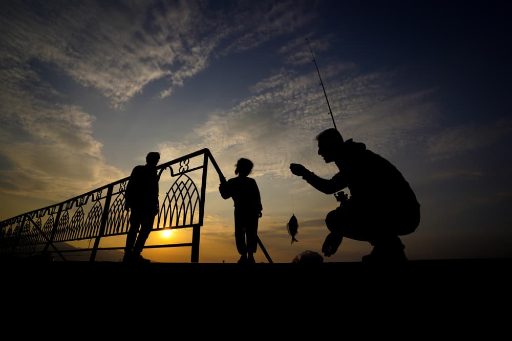 Father Son Sunset Fishing by Seray AK — canvas wall art
