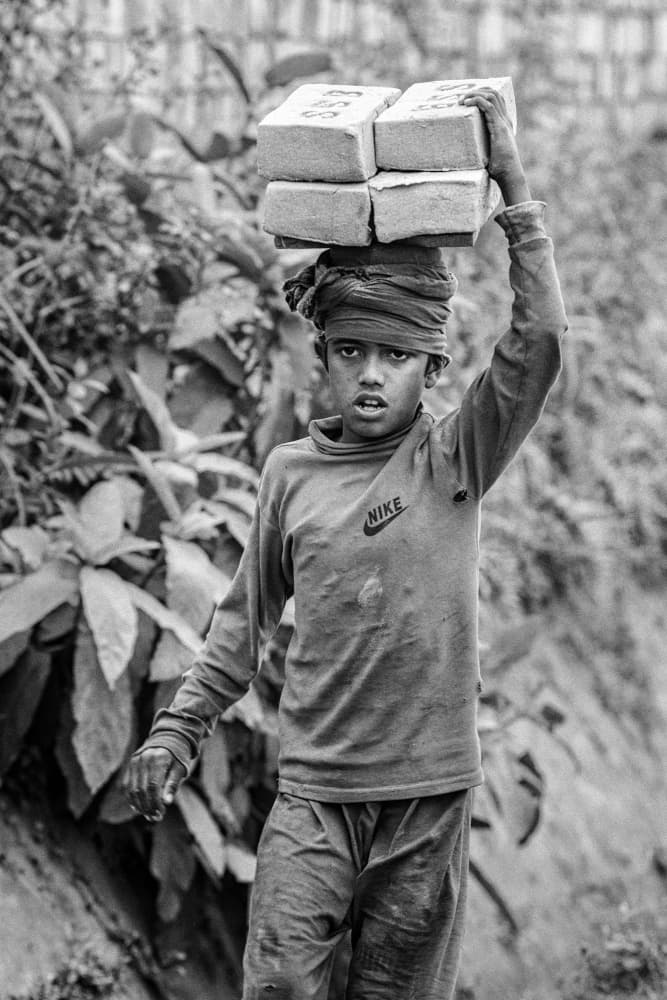 Boy Carrying Bricks by Garik — canvas wall art