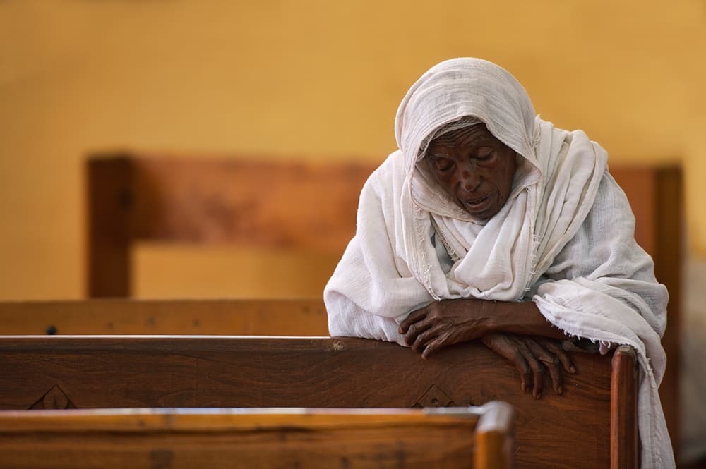 Elderly Woman Praying by Wendy — canvas wall art