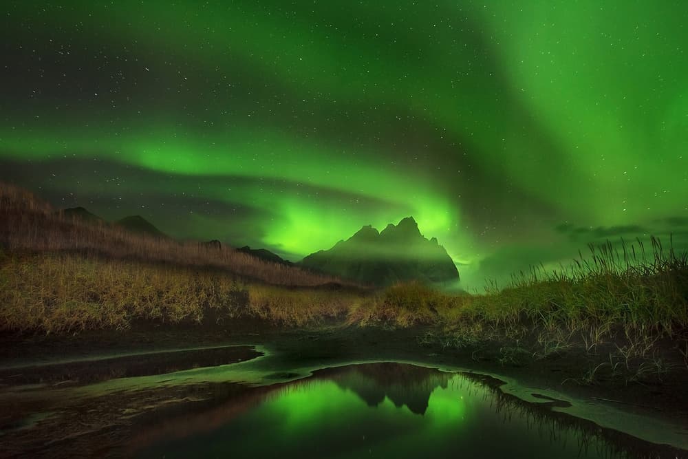 Green Aurora Mountain Reflection by Mirko Vecernik — canvas wall art