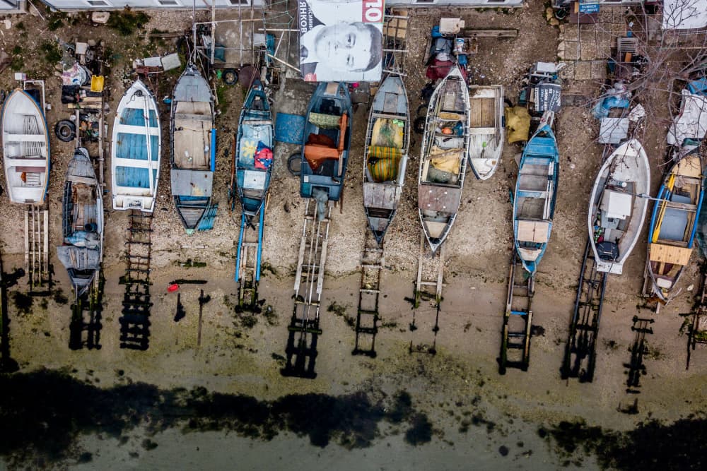 Weathered Fishing Boats by Ovi D. Pop — canvas wall art
