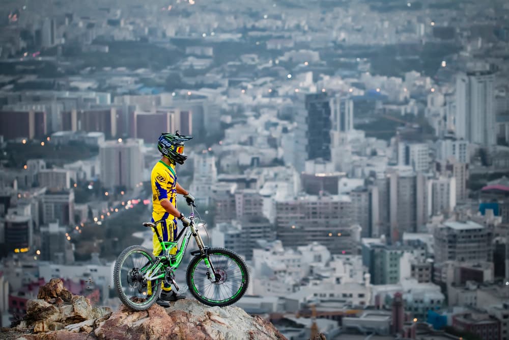 Mountain Biker City Skyline by Ehsan Minaeian — canvas wall art