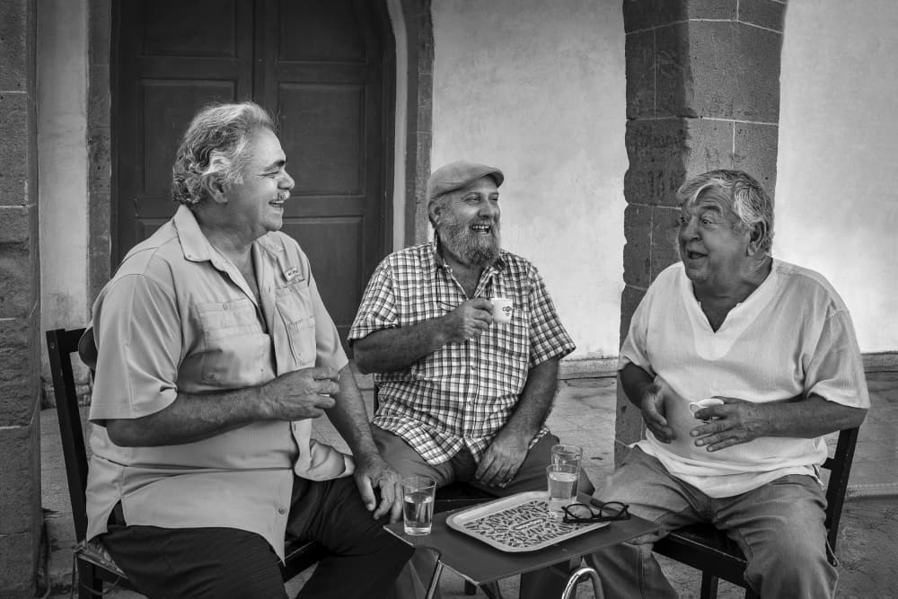 Friends Over Coffee by Emel Sefer — canvas wall art