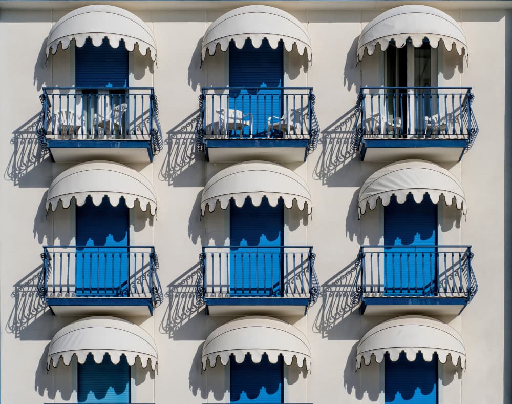 Blue Awnings And Balconies by Tommaso Pessotto — canvas wall art