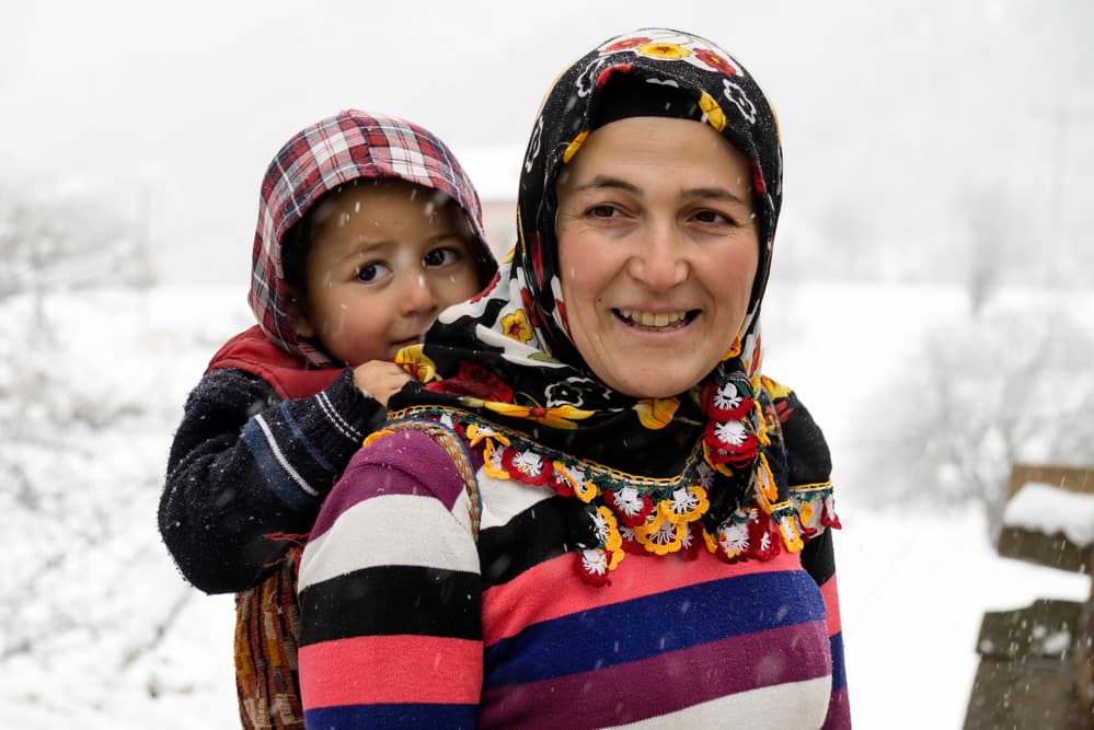 Snowy Mother and Child by Hakime Küçük — canvas wall art