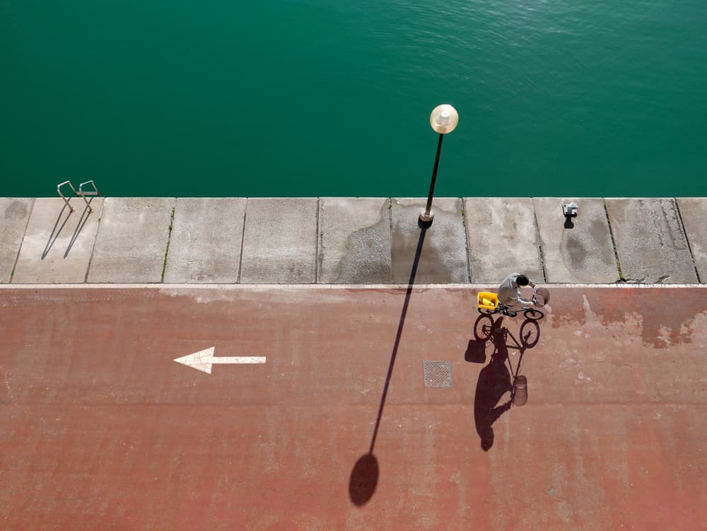 Sunny Dockside Bike Ride by paolo luxardo — canvas wall art