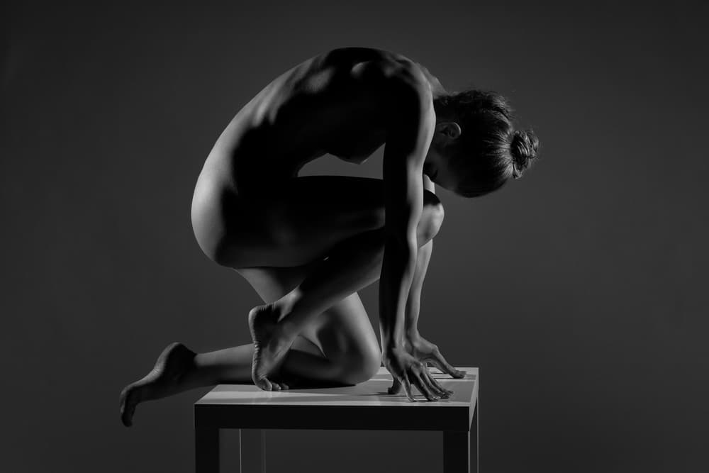 Graceful Crouching Nude Form