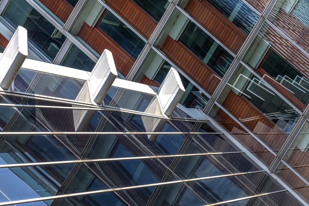 Geometric Building Reflections by Theo Luycx — canvas wall art