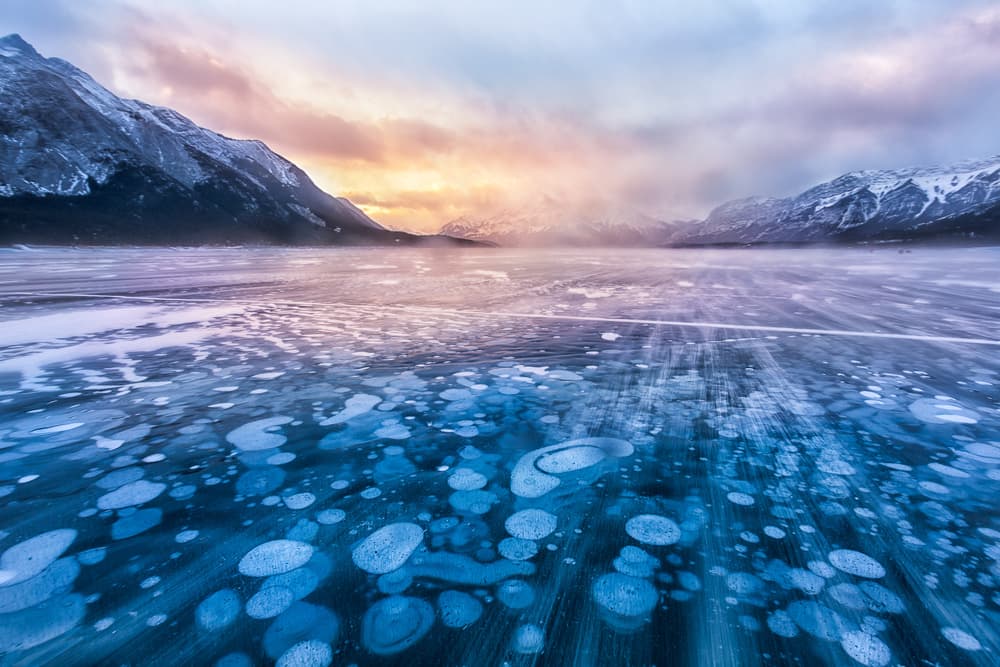 Ice Bubbles Mountain Lake by Yimei Sun — canvas wall art