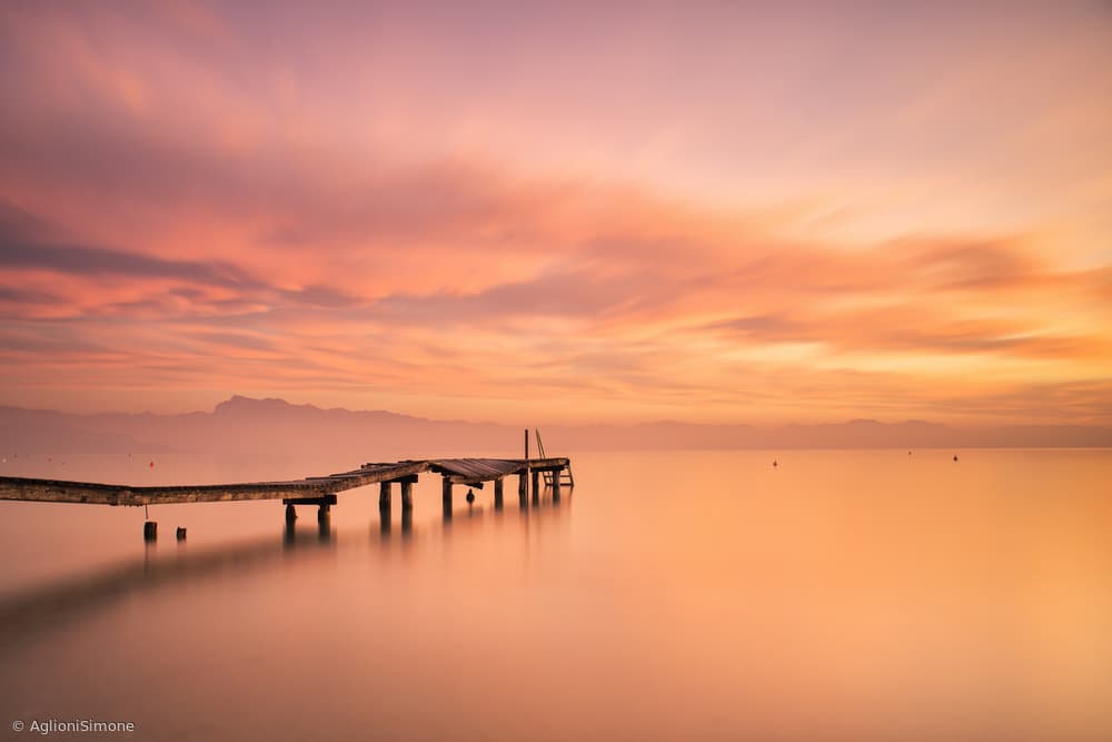 Tranquil Pier Sunset Reflections by Aglioni Simone — canvas wall art