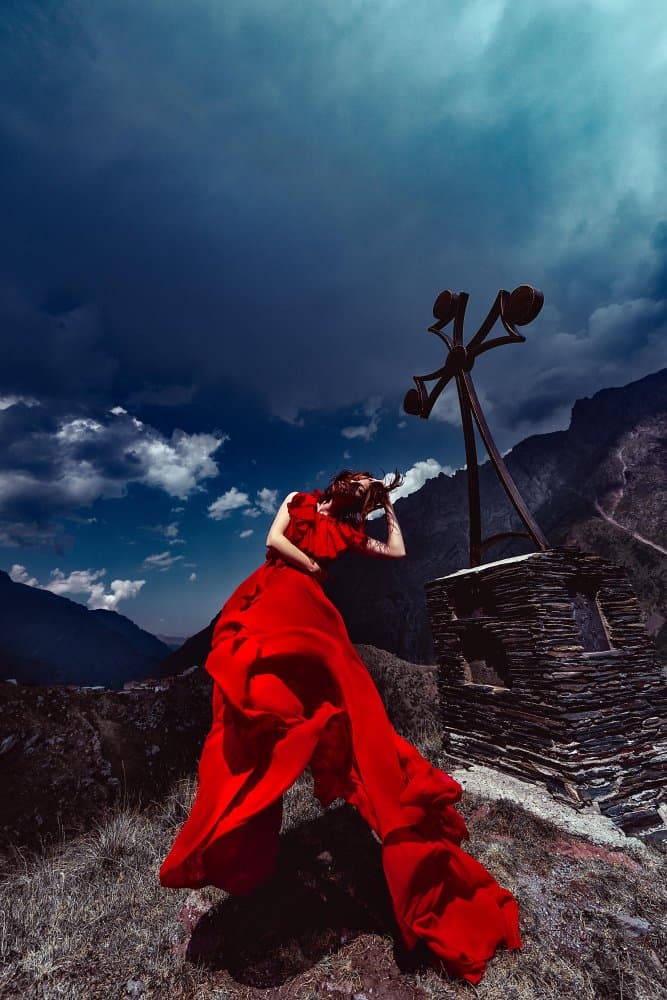 Red Dress Mountain Drama by Ruslan Bolgov — canvas wall art