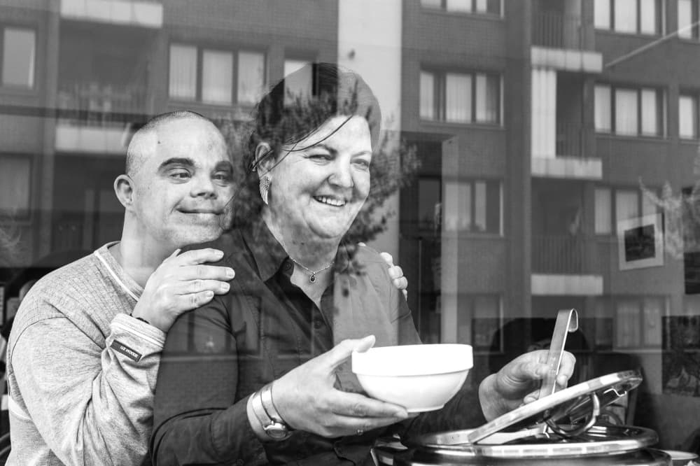 Happy People Serving Meal by Hilde Ghesquiere — canvas wall art