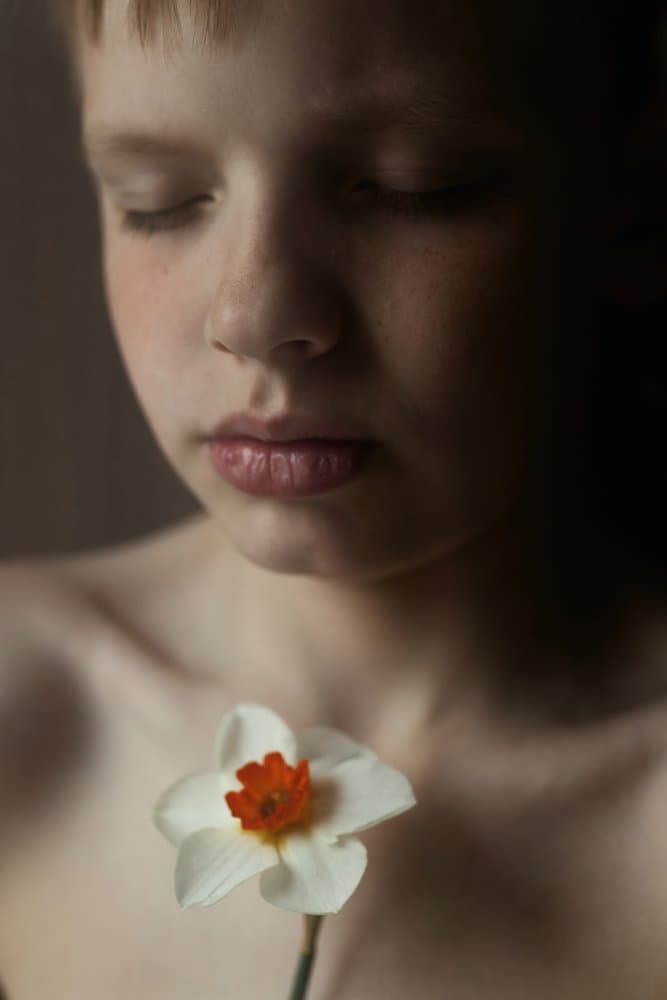 Serene Child With Daffodil by Olessya Mikhailova — canvas wall art