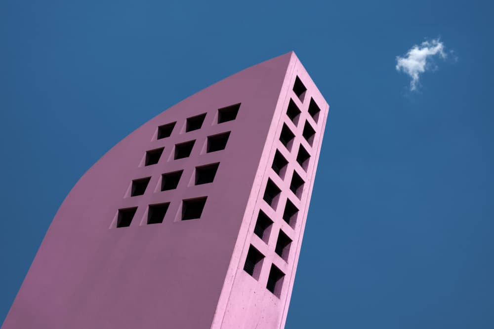 Pink Building Blue Sky by Rolf Endermann — canvas wall art