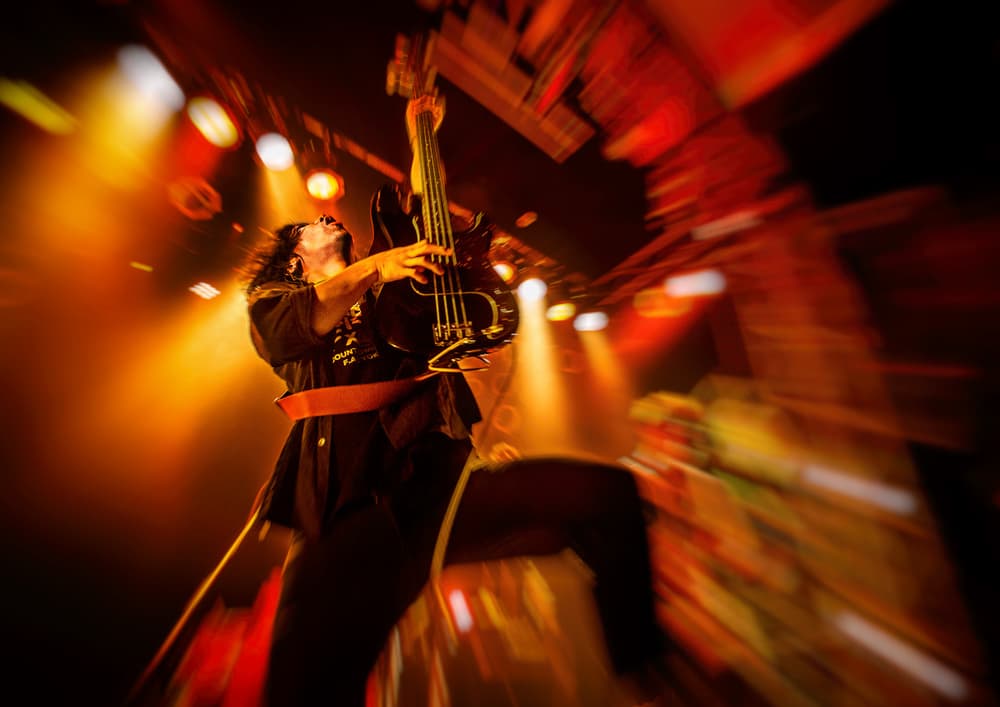 Energetic Bass Player Onstage by Kenji Nakamatsu — canvas wall art