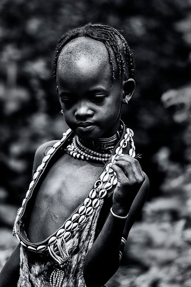 African Child with Shells by Amnon Eichelberg — canvas wall art