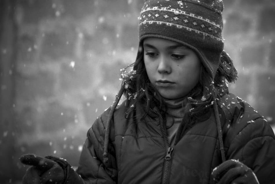 Pensive Girl In Snow by Codrin Lupei — canvas wall art