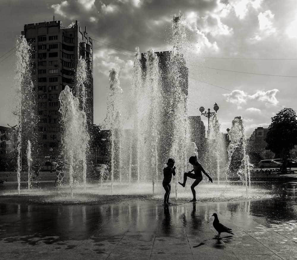 Children Splashing Fountain by Dmitry Nesvetaylov — canvas wall art