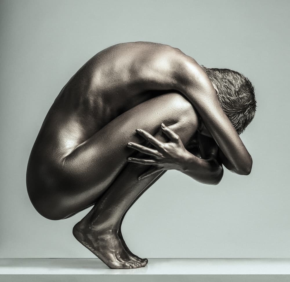 Huddled Bronze Figure by AURIMAS VALEVICIUS — canvas wall art