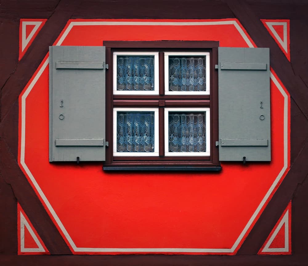 Red Facade Window Shutters by Hans-Wolfgang Hawerkamp — canvas wall art