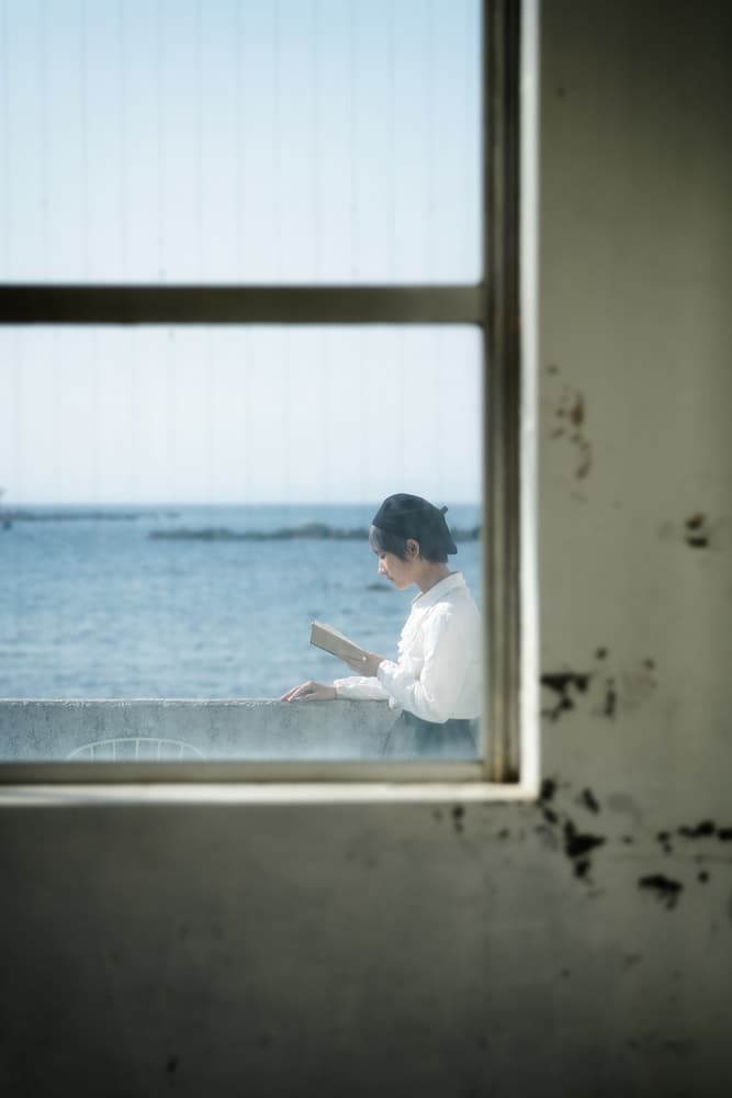 Woman Reading Sea View by Nobu Ishijima — canvas wall art
