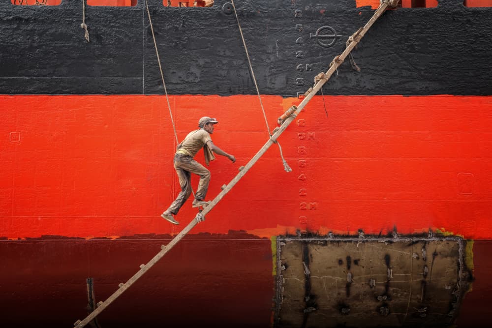 Man Scaling Red Ship by Richard Huang — canvas wall art