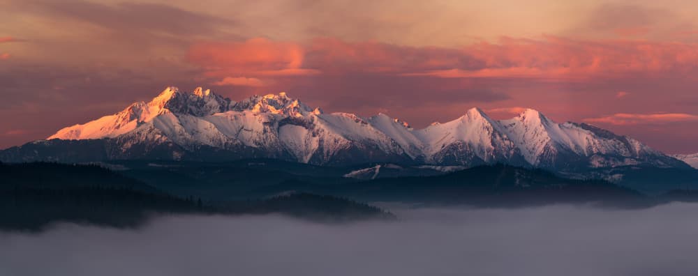 Pink Sky Snowy Mountains by Krzysztof Mierzejewski — canvas wall art