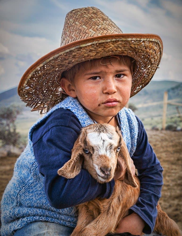Young Boy And Goat by durmusceylan — canvas wall art