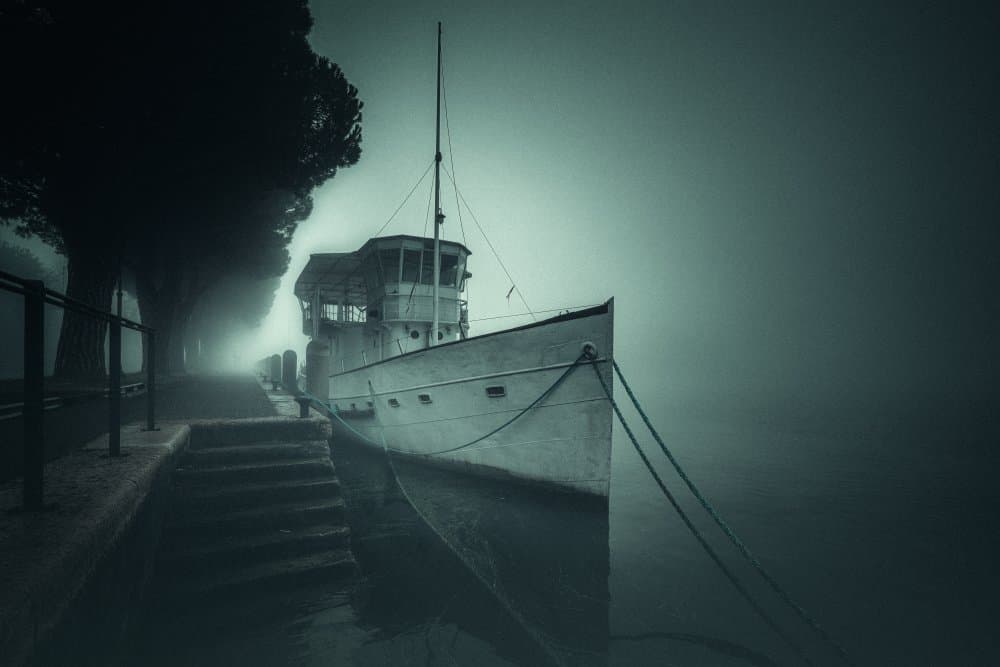 Misty Dock Boat by Andrea Fraccaroli — canvas wall art