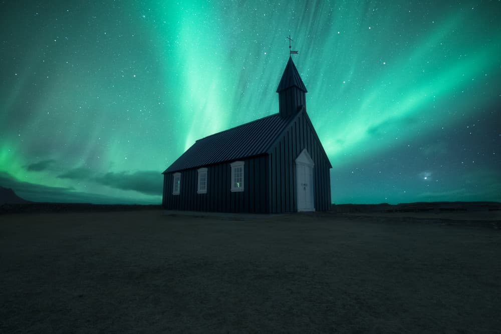 Black Church Northern Lights by Carlos Gonzalez — canvas wall art